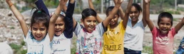 An image containing children who are smiling after getting education with the help of non profit organizations.